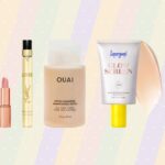 Mini beauty products from Charlotte Tilbury, Yves Saint Laurent, Ouai, Supergoop! and L’Occitane displayed against a pastel striped background.