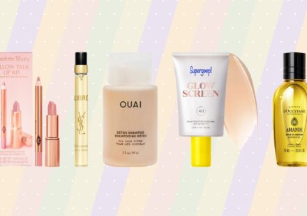 Mini beauty products from Charlotte Tilbury, Yves Saint Laurent, Ouai, Supergoop! and L’Occitane displayed against a pastel striped background.